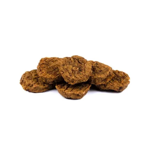 Brit Meaty Jerky Rabbit Meaty Coins er bløde og kødfulde hundesnacks med kanin, beriget med blåbær og perfekte til belønning