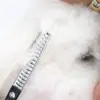 Rosella efillérsaks klipper præcist og nemt igennem pelsen på Coton de Tulear.